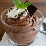 chocolate mascarpone mousse served in clear dessert cups, garnished with chocolate shavings and mint