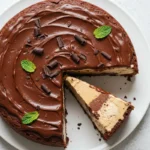 a Mocha Brownie Ice Cream Cake with chocolate ganache and mint garnish