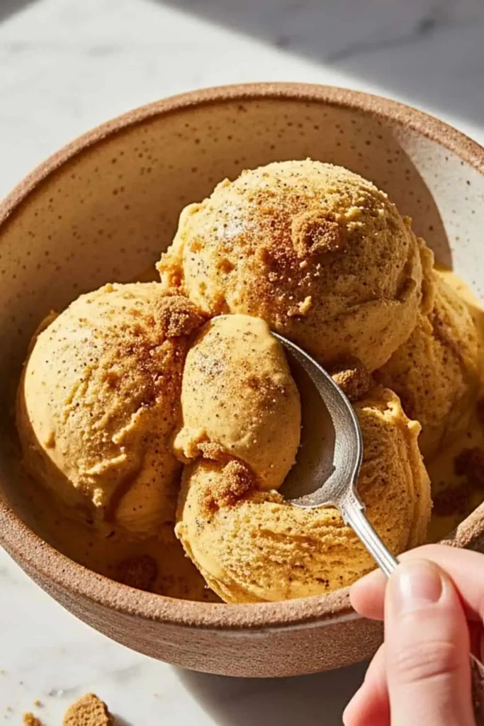 Creamy, dreamy Pumpkin Spice Ice Cream made without an ice cream maker using just heavy cream, sweetened condensed milk, and warm autumn spices.