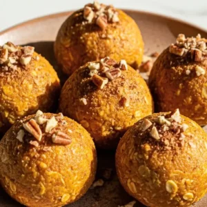 Pumpkin Spice Protein Balls in a simple plate